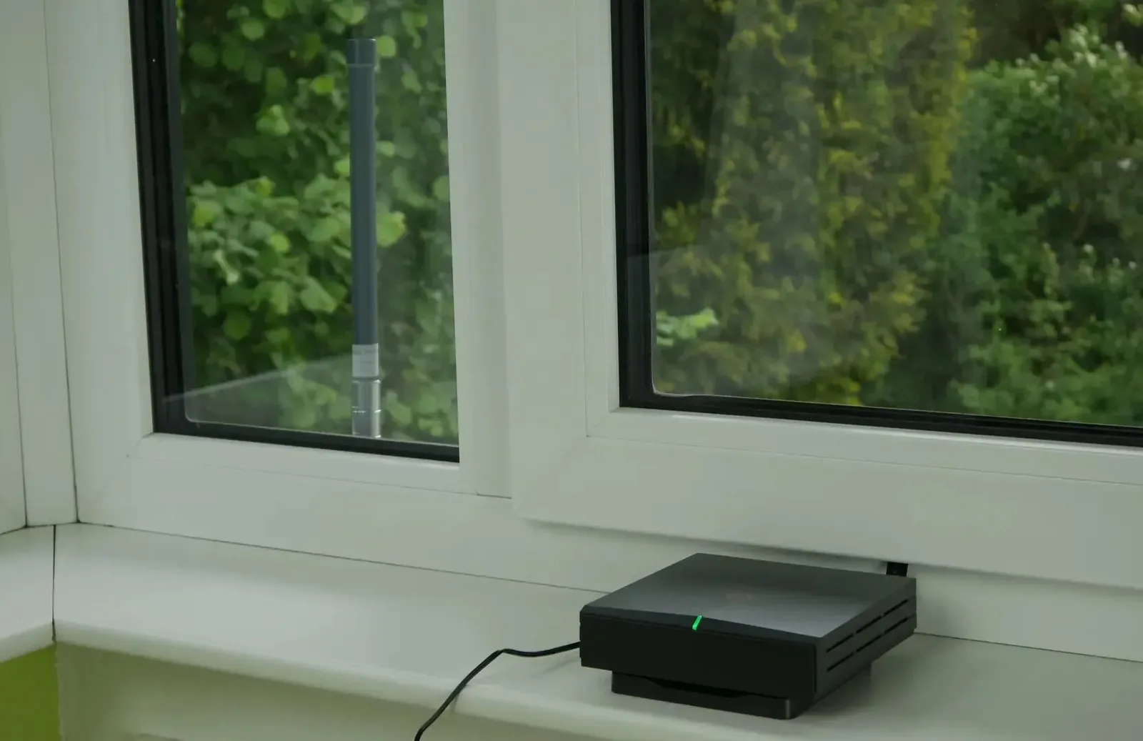 An installed IoT hotspot on a window sill at a host location